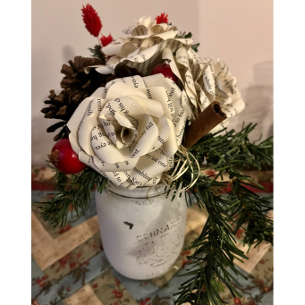 A trio of cabbage roses made from reclaimed book pages